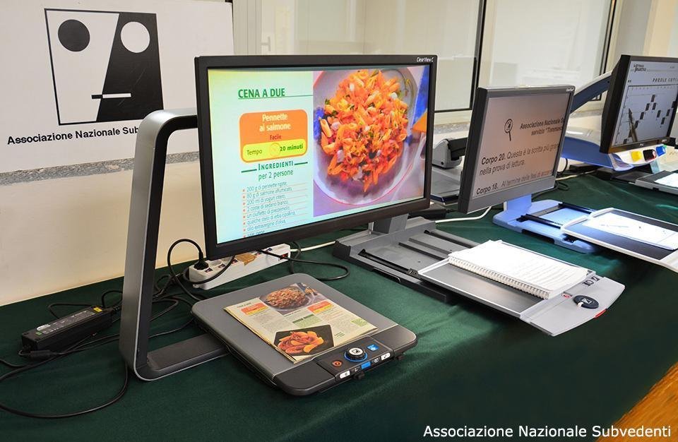 Desktop video magnifier enlarging printed material on a screen